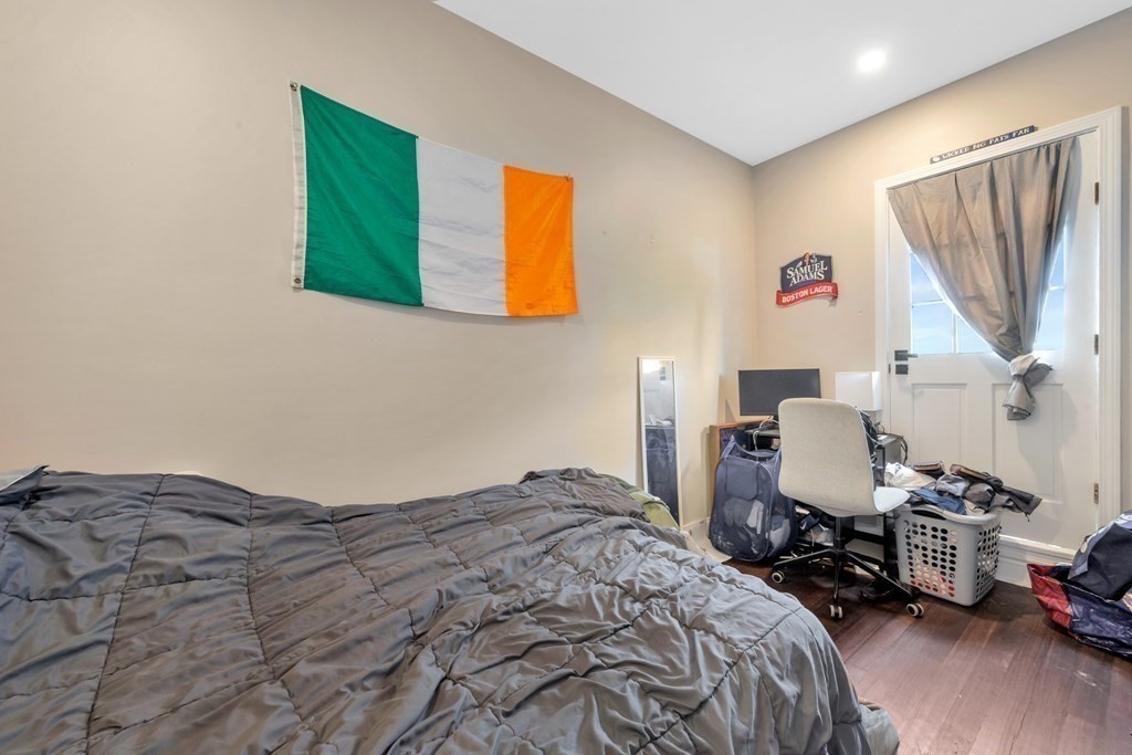 777 Columbia Road Boston, MA 02125 - Photo 34 of 39 a bedroom with a bed a window and dresser