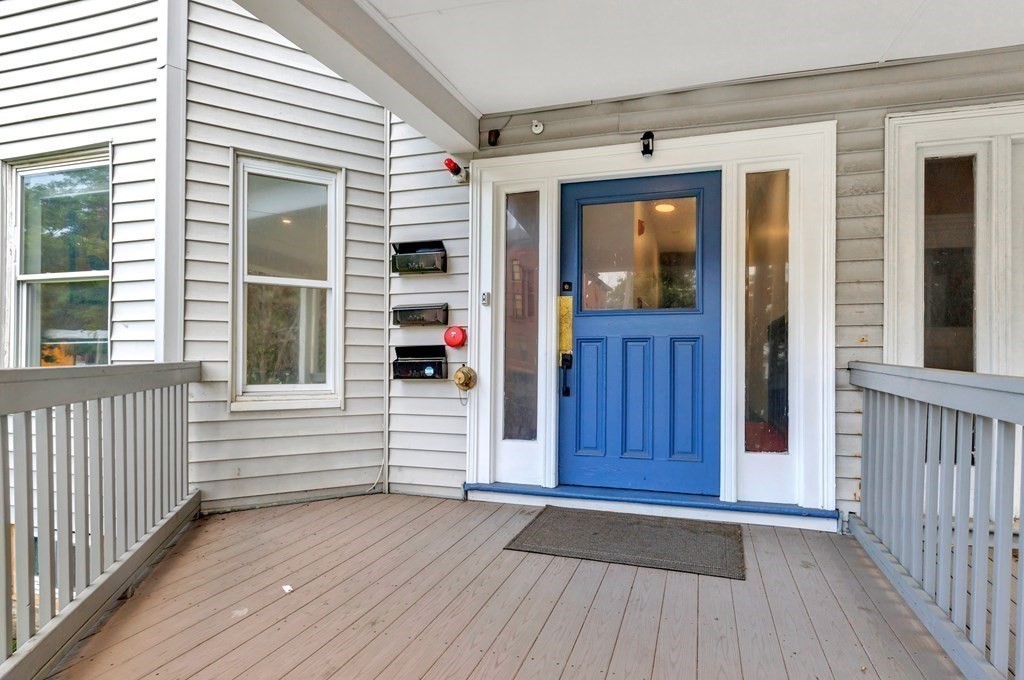 777 Columbia Road Boston, MA 02125 - Photo 38 of 39 a view of a porch with wooden floor and windows