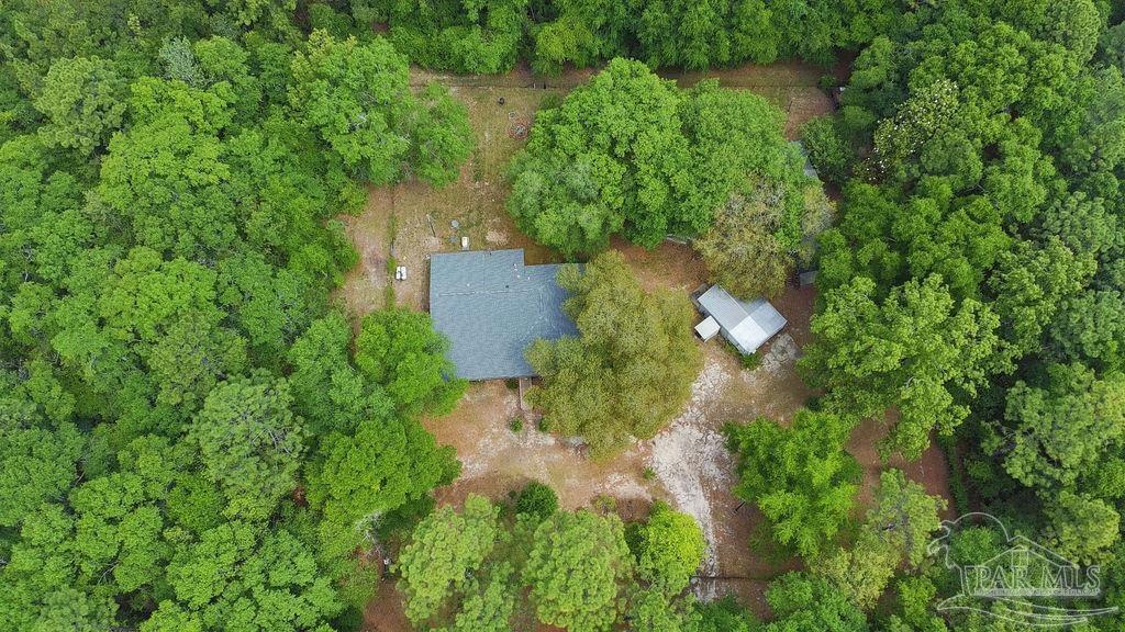 8938 Pioneer Road Holt, FL 32564 - Photo 39 of 44 an aerial view of residential house with outdoor space and trees all around