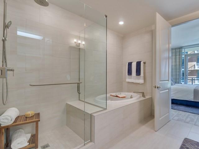 7775 Firefall Way, Unit 1204 Dallas, TX 75230 - Photo 8 of 23 a bathroom with a bathtub a toilet a sink and mirror