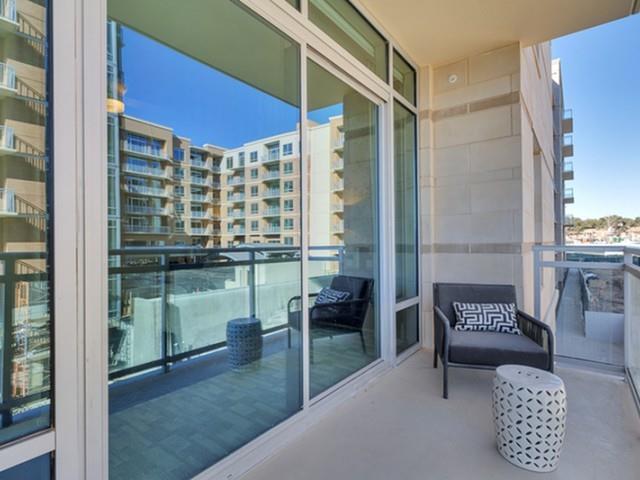 7775 Firefall Way, Unit 1204 Dallas, TX 75230 - Photo 9 of 23 a balcony with furniture and a potted plant