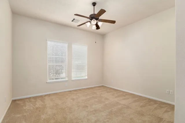 a bathroom with a double vanity sink a mirror and a shower