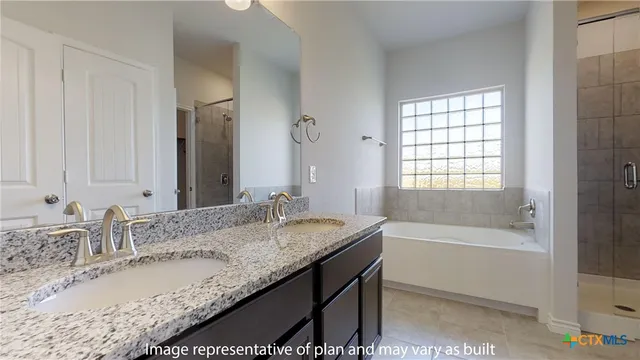 a bathroom with a bathtub and shower