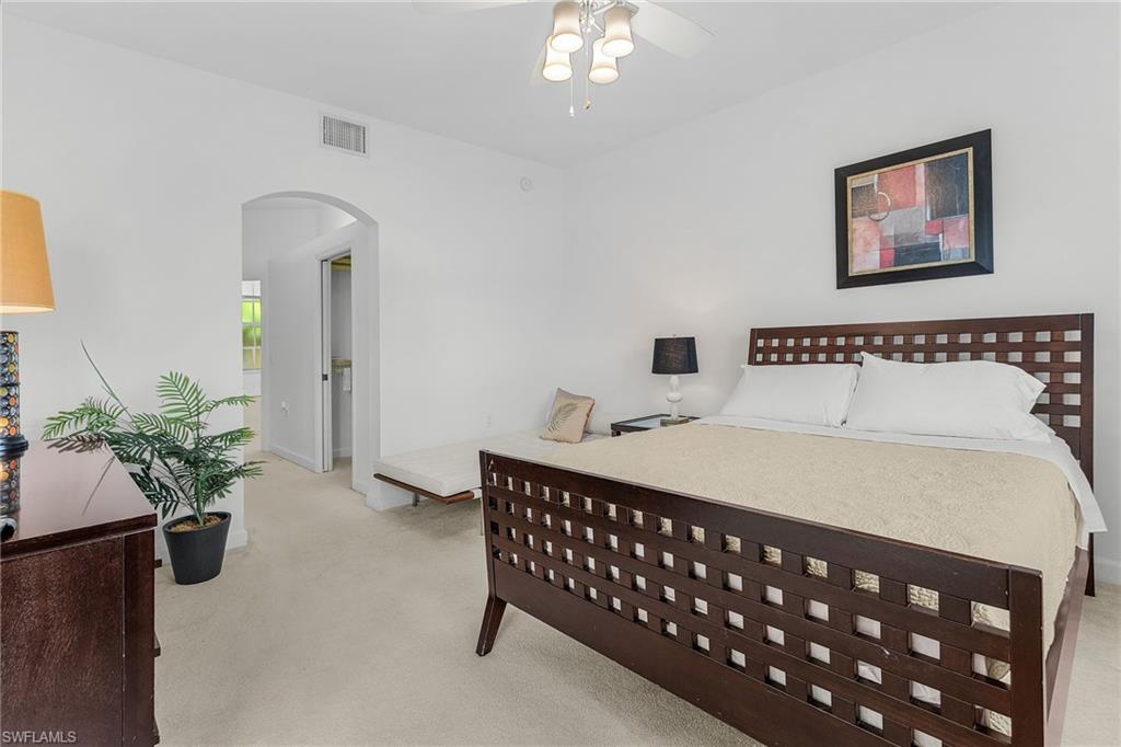 20240 Burnside Place, Unit 1603 Estero, FL 33928 - Photo 19 of 41 a bedroom with a bed table and window