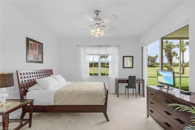 a bedroom with a bed flowerpot and window