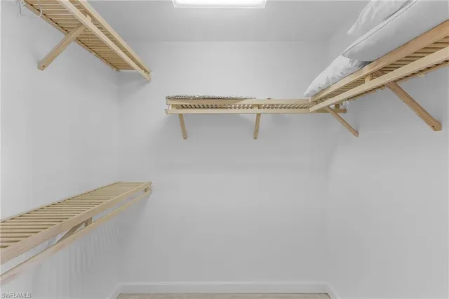 a bedroom with two beds and a table
