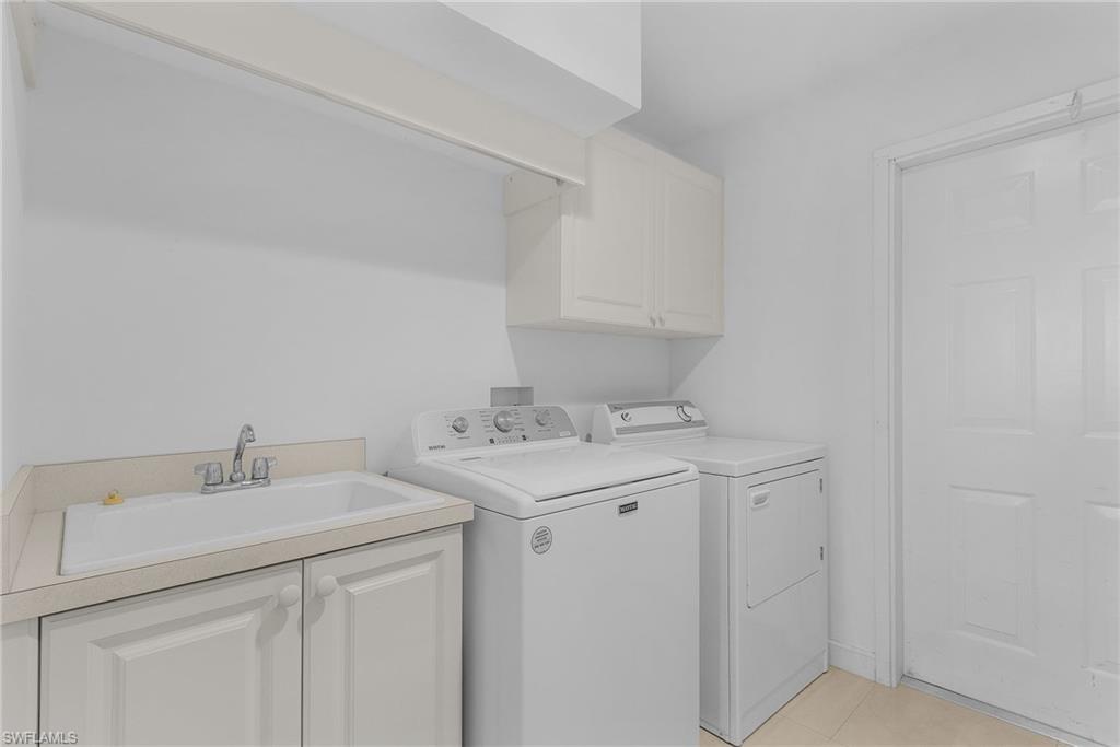 20240 Burnside Place, Unit 1603 Estero, FL 33928 - Photo 30 of 41 a utility room with sink dryer and washer