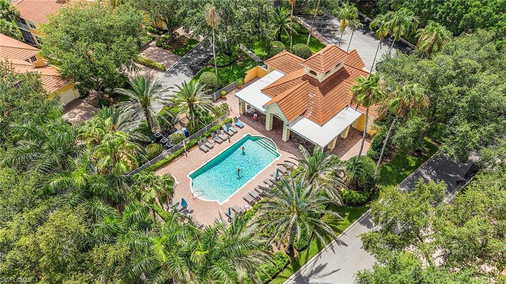 20240 Burnside Place, Unit 1603 Estero, FL 33928 - Photo 39 of 41 an aerial view of a house with a yard and trees