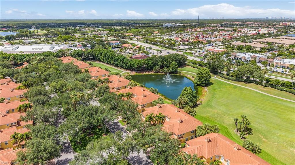 20240 Burnside Place, Unit 1603 Estero, FL 33928 - Photo 40 of 41 an aerial view of residential building and lake