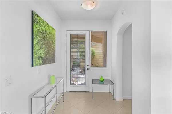 a view of an entryway with wooden floor