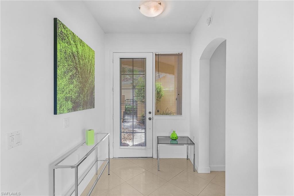20240 Burnside Place, Unit 1603 Estero, FL 33928 - Photo 6 of 41 a view of an entryway with wooden floor