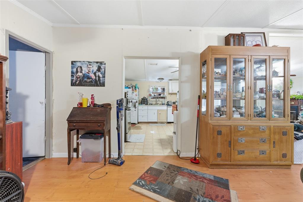 13050 Sun Road Brooksville, FL 34613 - Photo 13 of 47 a living room with fireplace furniture and a window