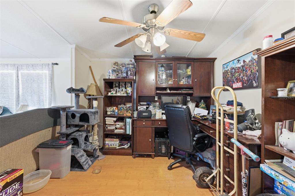 13050 Sun Road Brooksville, FL 34613 - Photo 14 of 47 a view of a room with workspace and music instruments