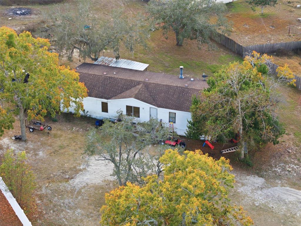13050 Sun Road Brooksville, FL 34613 - Photo 16 of 47 a view of house with a yard