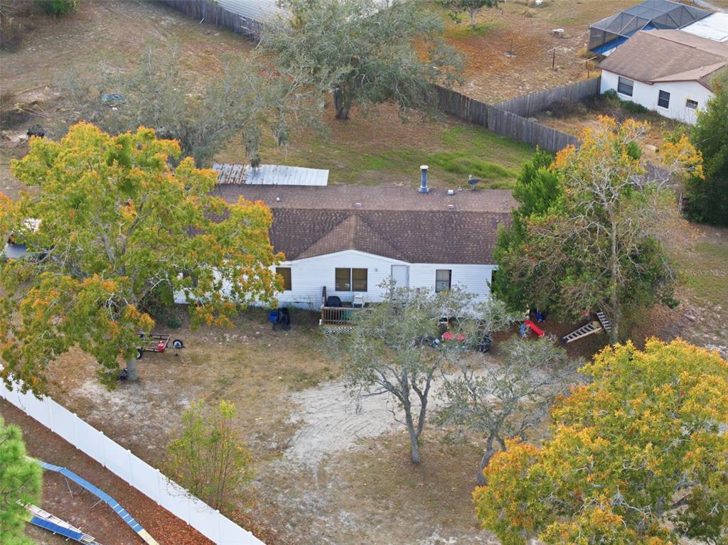 13050 Sun Road Brooksville, FL 34613 - Photo 2 of 47 a view of a house with a yard