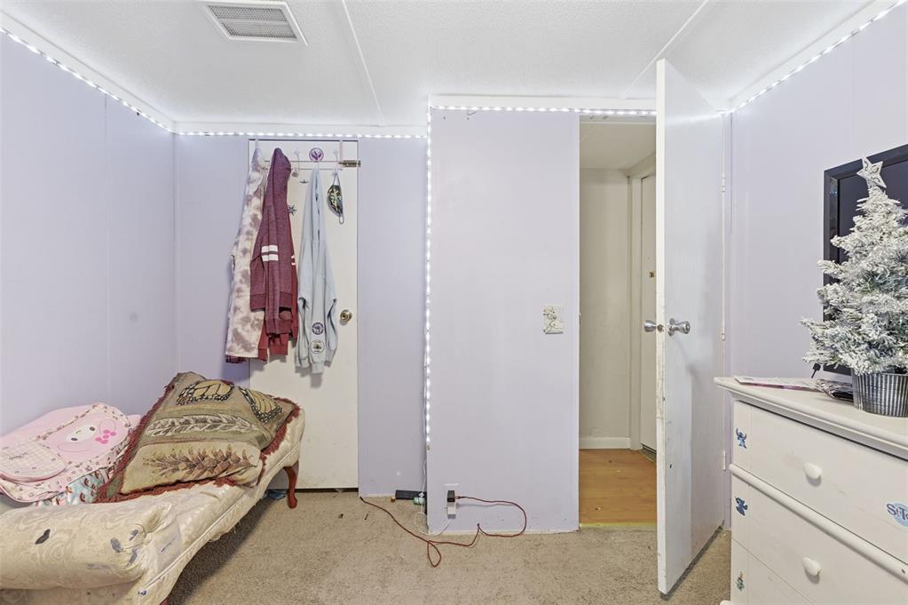 13050 Sun Road Brooksville, FL 34613 - Photo 27 of 47 a bedroom with a bed and a dresser