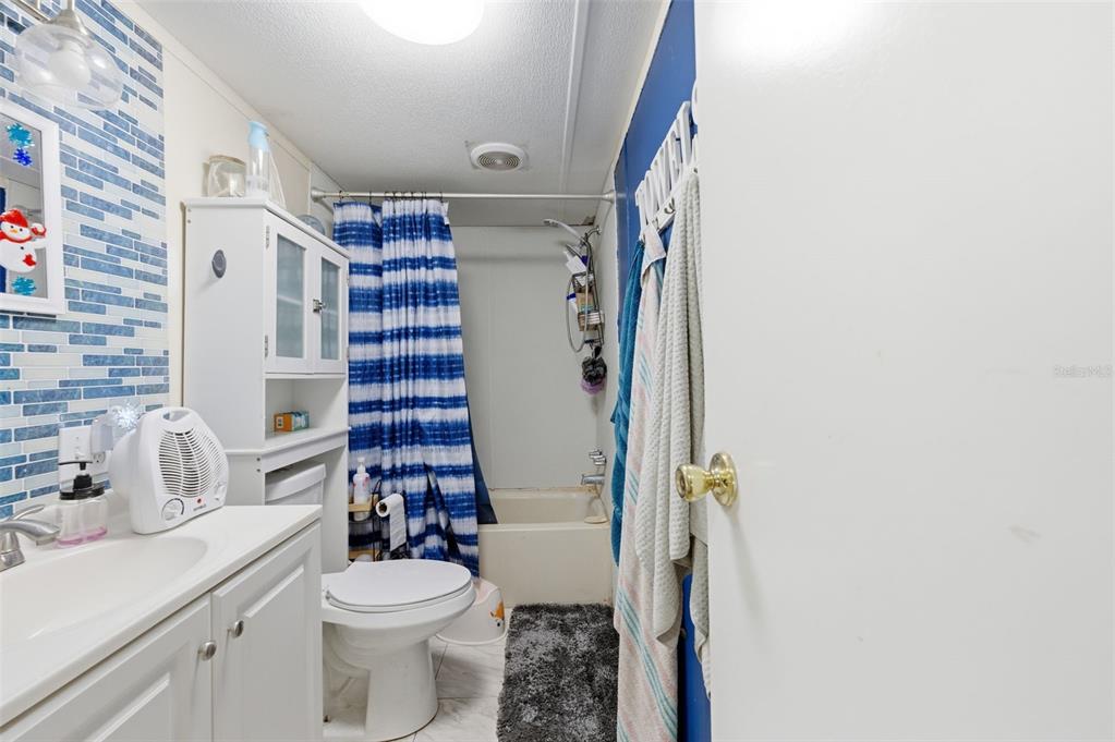 13050 Sun Road Brooksville, FL 34613 - Photo 34 of 47 a bathroom with a sink toilet and shower