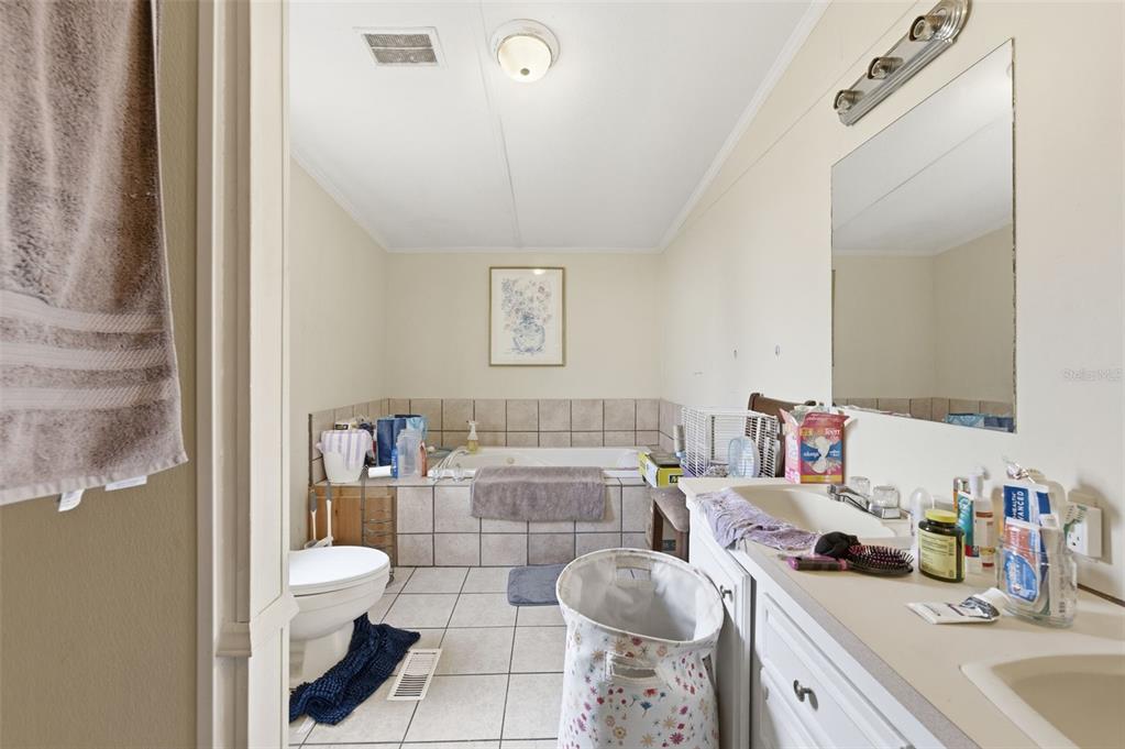 13050 Sun Road Brooksville, FL 34613 - Photo 38 of 47 a bathroom with a sink toilet and shower