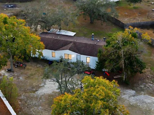 a view of a backyard of the house