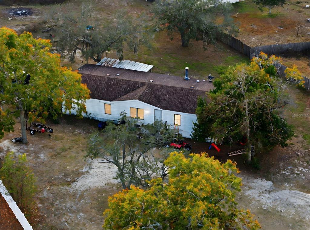 13050 Sun Road Brooksville, FL 34613 - Photo 10 of 47 a view of a backyard of the house