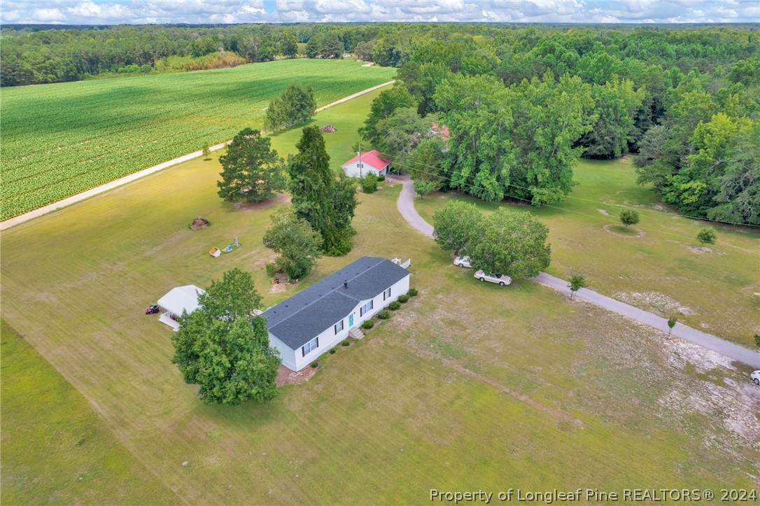 2147 Bainbridge Road Stedman, NC 28391 - Photo 41 of 42 a view of a lake with a yard