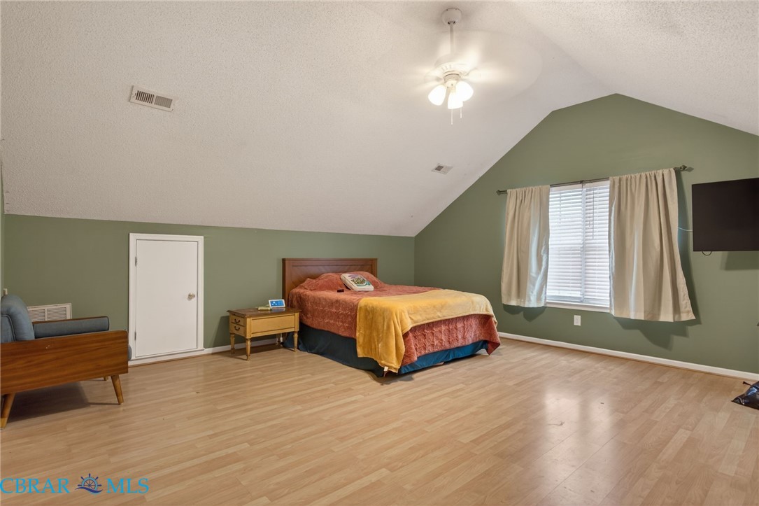116 Old Field Road Williamsburg, VA 23188 - Photo 25 of 27 Bedroom featuring a textured ceiling, wood finished floors, and ceiling fan