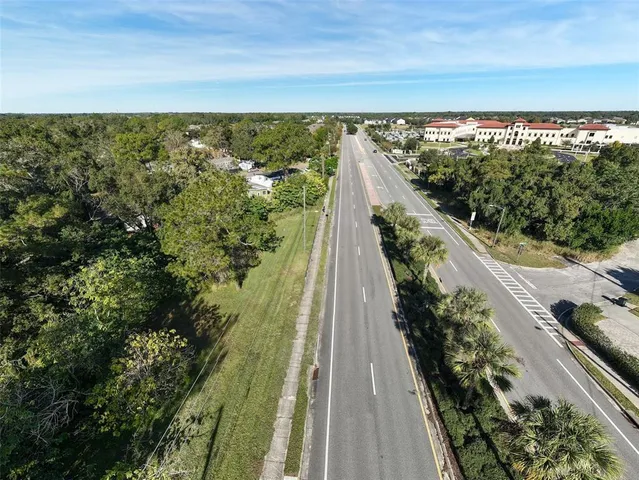 a view of a yard from a balcony