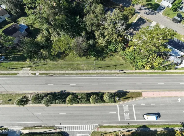 a view of a yard with a street
