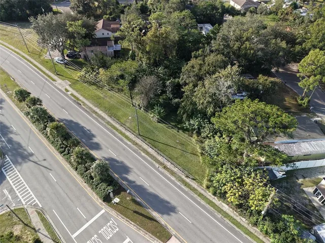 a view of a yard with potted plants
