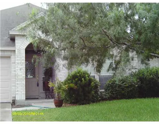 a view of a house with a garden