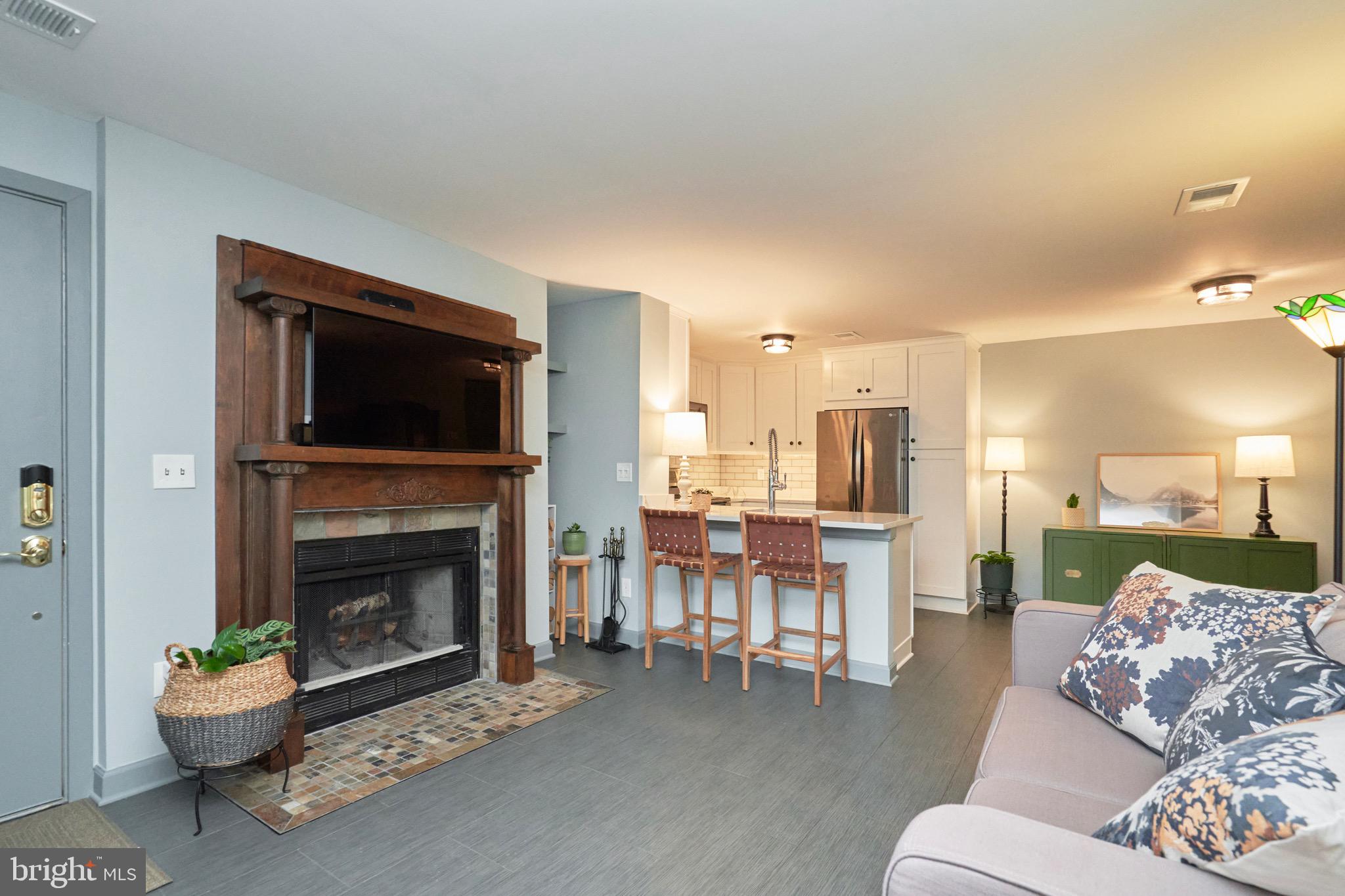 11703 Summerchase Circle Reston, VA 20194 - Photo 9 of 33 Antique mantel around wood burning fireplace