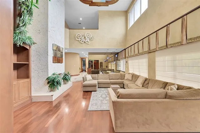 a view of a dining room with furniture and a chandelier