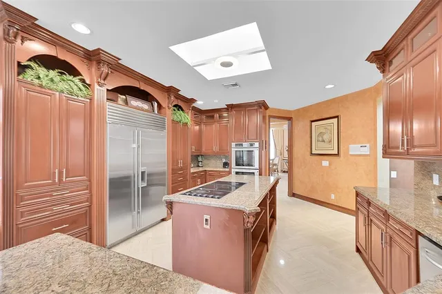 a view of a hallway with furniture and floor to ceiling window