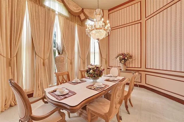 a bedroom with a large bed and flat tv