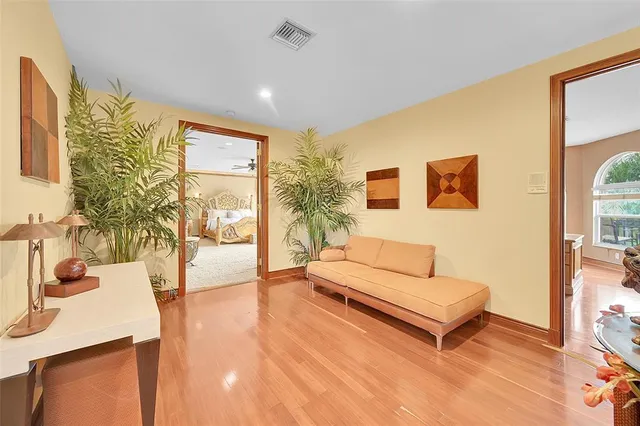 a bedroom with a large bed and a large window