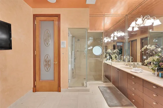 a bathroom with a sink toilet and shower