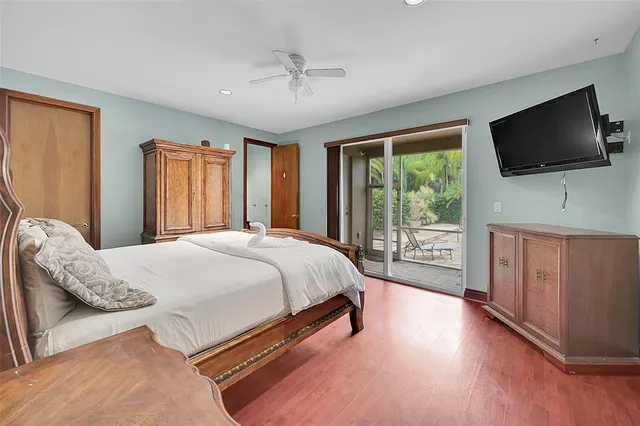 a view of a swimming pool with a patio and a yard