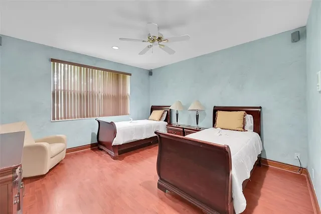 a view of house with swimming pool outdoor seating