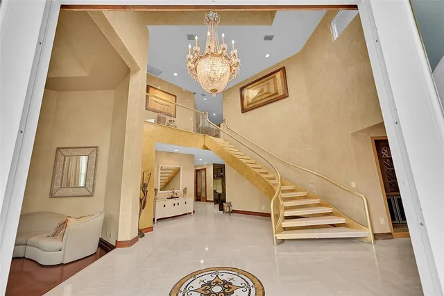 a view of living room with furniture and floor to ceiling windows