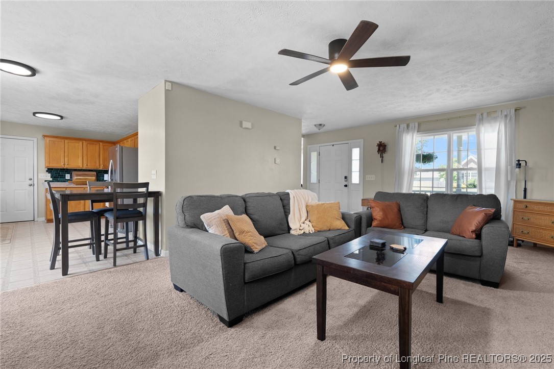 106 Polk Street Spring Lake, NC 28390 - Photo 12 of 47 a living room with furniture kitchen view and a window