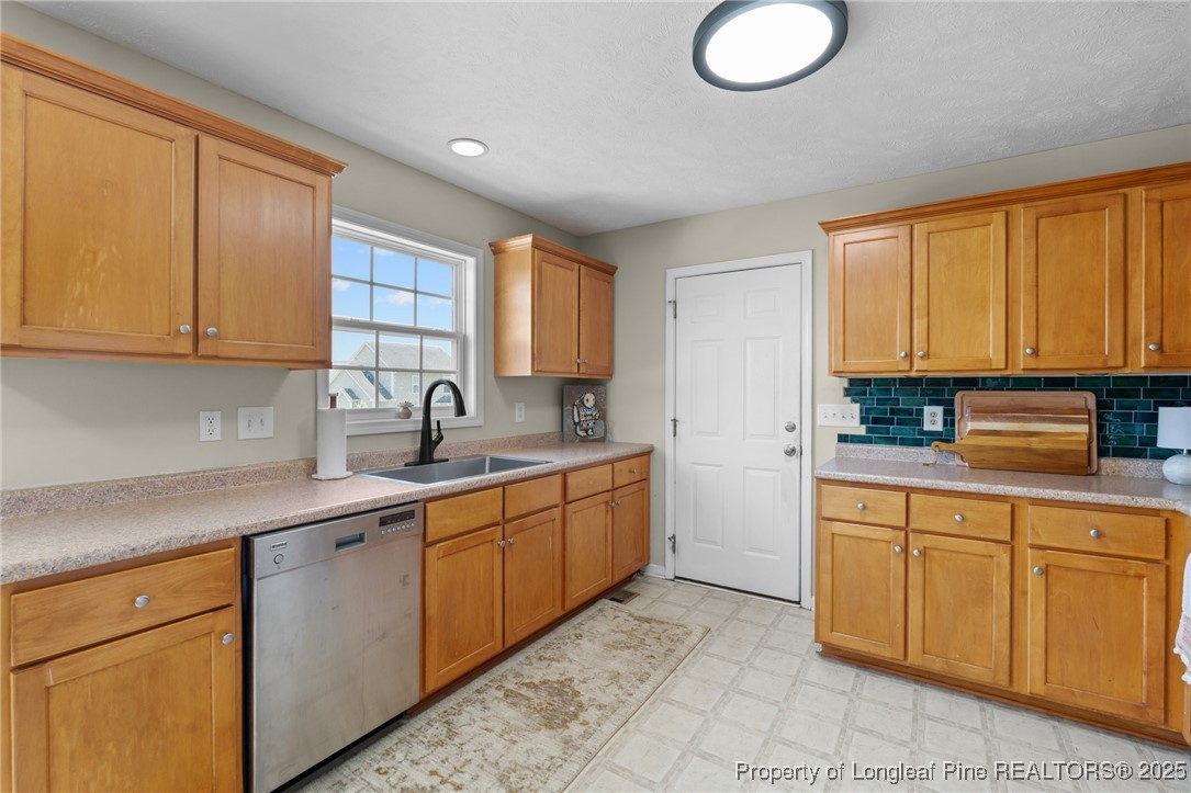 106 Polk Street Spring Lake, NC 28390 - Photo 14 of 47 a kitchen with sink cabinets and window