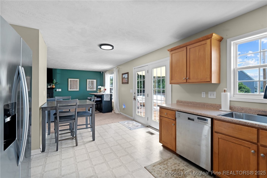 106 Polk Street Spring Lake, NC 28390 - Photo 17 of 47 a kitchen with cabinets and chairs