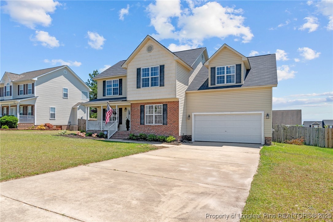 106 Polk Street Spring Lake, NC 28390 - Photo 2 of 47 a front view of house with yard and green space