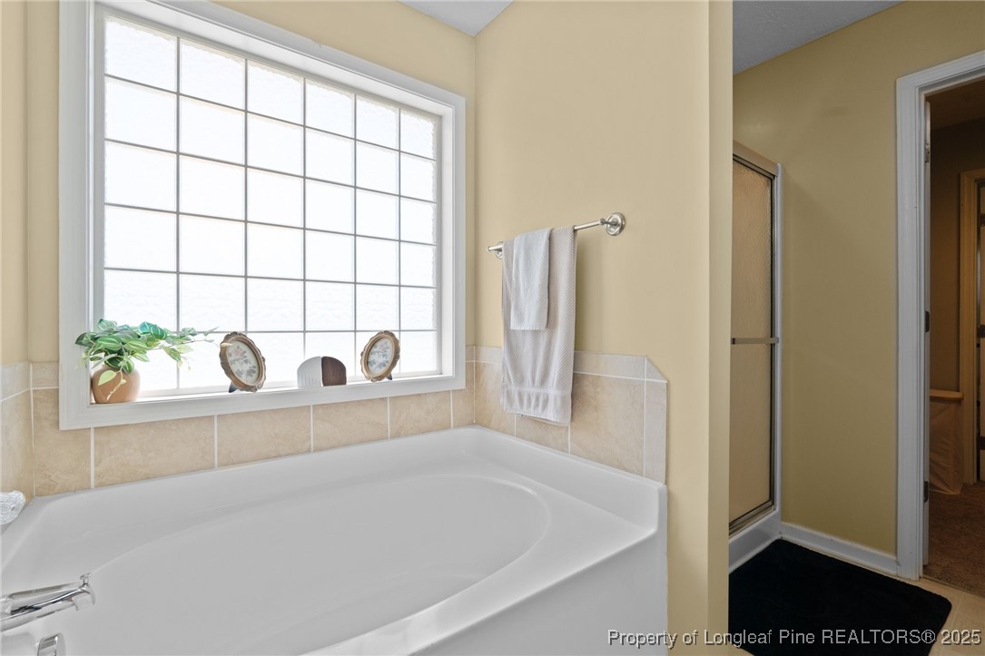 106 Polk Street Spring Lake, NC 28390 - Photo 25 of 47 a close view of a bathtub in a bathroom