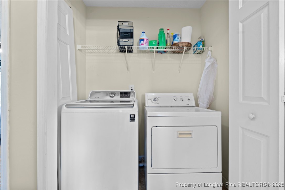 106 Polk Street Spring Lake, NC 28390 - Photo 28 of 47 a utility room with dryer and washer