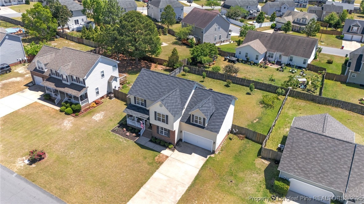 106 Polk Street Spring Lake, NC 28390 - Photo 44 of 47 an aerial view of a house with swimming pool and large trees