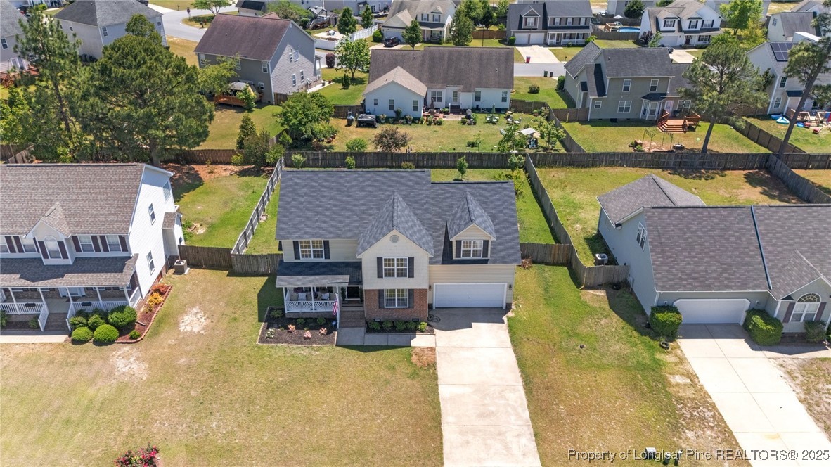 106 Polk Street Spring Lake, NC 28390 - Photo 45 of 47 an aerial view of a house with swimming pool and large trees