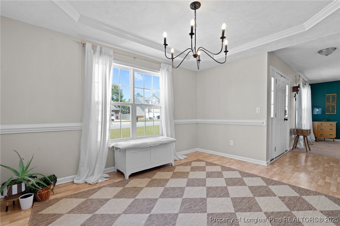 106 Polk Street Spring Lake, NC 28390 - Photo 8 of 47 a view of a big room with a chandelier and living room
