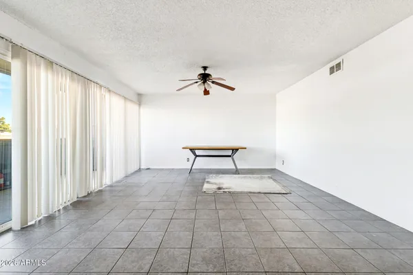 a view of an empty room and a window