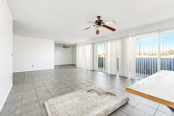 a kitchen with granite countertop a stove top oven sink and cabinets